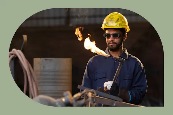 welder with flaming torch