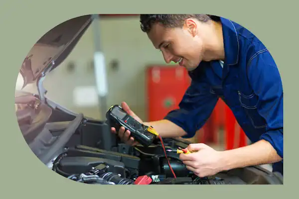 man happily working on an automobile